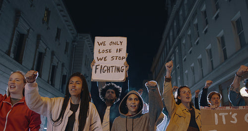 Group of activists protesting on road at night