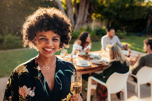 Smiling woman at outdoor party