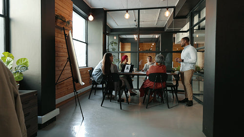 Diverse business team having a meeting in a creative coworking office