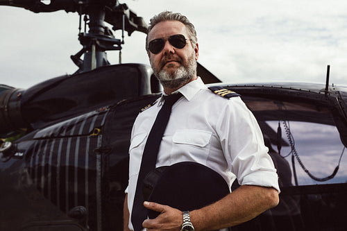 Helicopter pilot in uniform standing outside