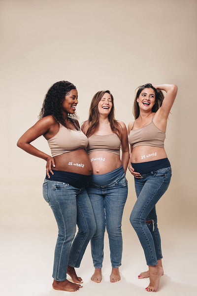 Pregnant mothers showing off baby bumps in a maternity shoot