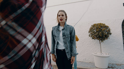 Girls playing together with jumping rope outdoors