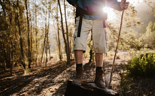 Hiker taking a break while hiking on mountain trail