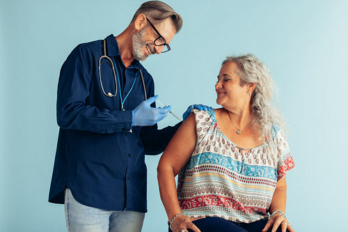 Senior woman getting flu vaccine