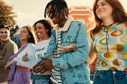 Group of friends enjoying a happy day in the city, smiling and having fun together