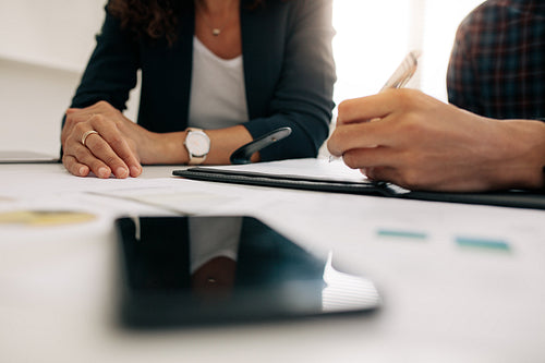 Business colleagues discussing work at office