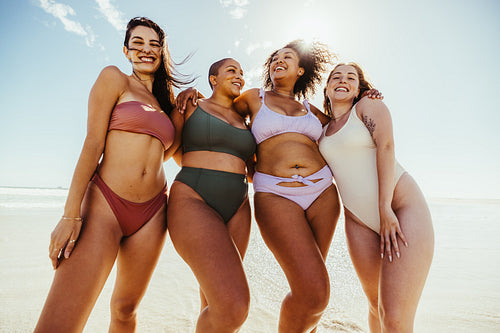 Four friends enjoying beach day together