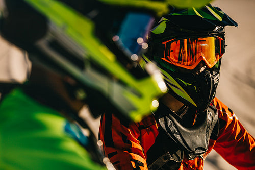 Motocross racers in protective gear 