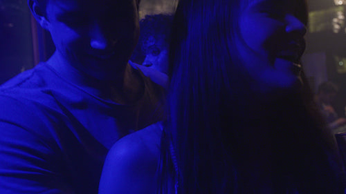 Loving couple dancing at nightclub