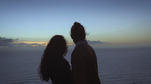 Romantic couple with seascape in background