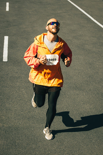 Determined marathon runner pushing through fatigue to finish line
