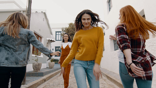 Girls dancing together outdoors