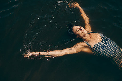 Woman swimming in a lake