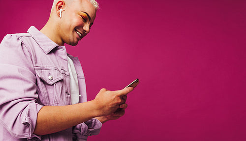 Non-conforming young man playing his favourite music