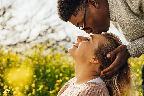 Romantic interracial couple outdoors
