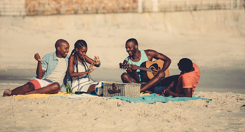 Group of people hanging out at the beach