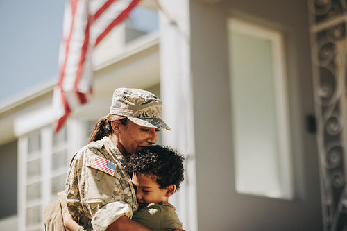 Mother and son reuniting after military deployment