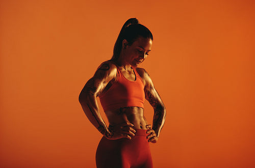 Muscular woman relaxing after workout