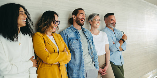 Successful business team laughing cheerfully in an office