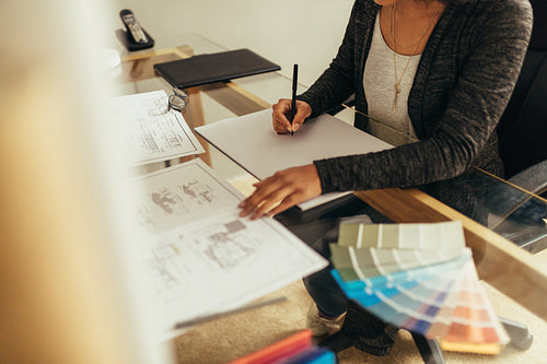 Female architect preparing new floor plan for a project