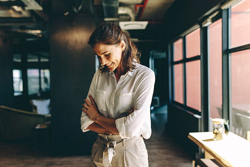 Businesswoman looking happy in office