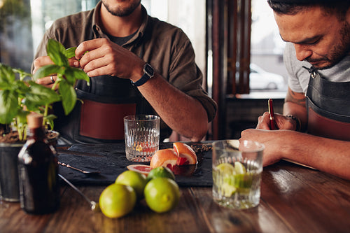 Bartenders experimenting with creating new cocktails ideas