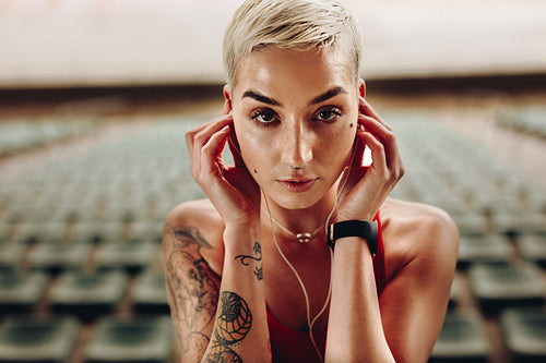 Close up of a woman athlete in stands of a stadium