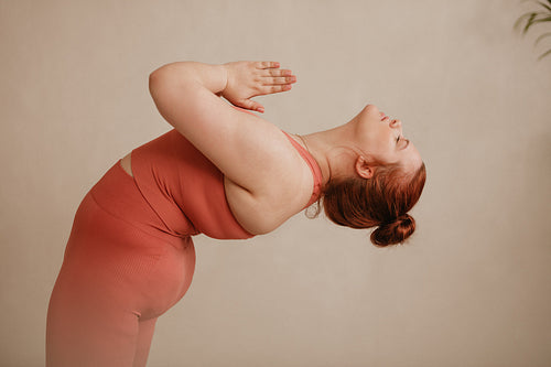  Healthy woman doing yoga exercise