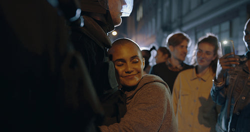 Girl embracing a policeman after a protest