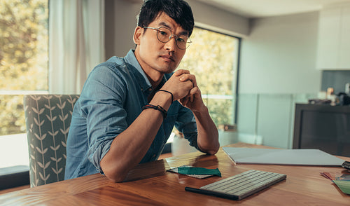 Confident architect at his work desk 