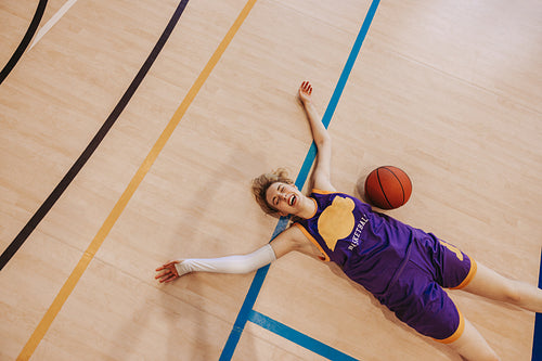 Hard-fought glory: Female athlete collapse with joy and exhaustion