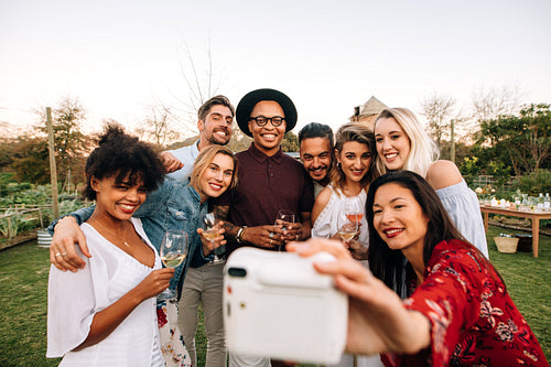 Group selfie at outdoor party