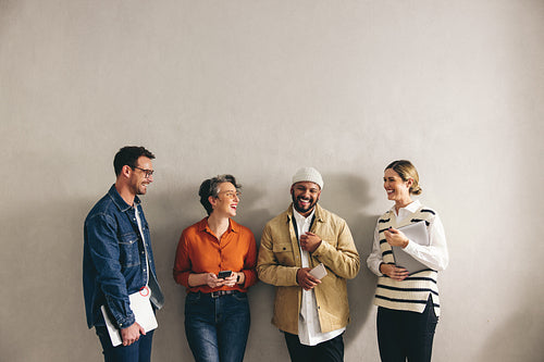 Happy businesspeople standing in a waiting area