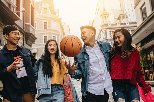 Young friends enjoying together on the street