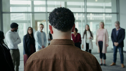 Diverse team collaborates in office meeting