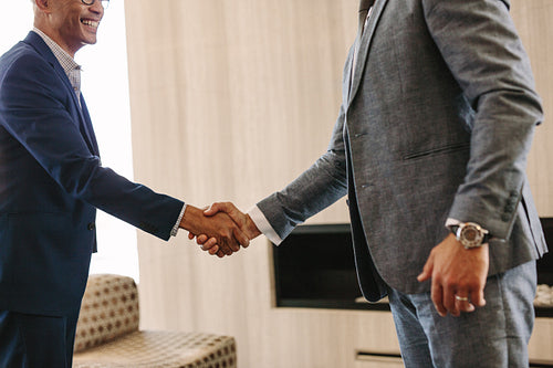 Business people hand shake in office