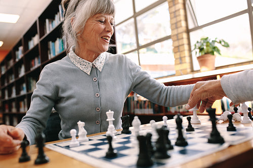 Close up of a woman playing chess