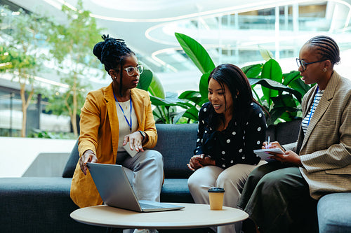 Accounting professionals discuss finance strategies in a modern office setting