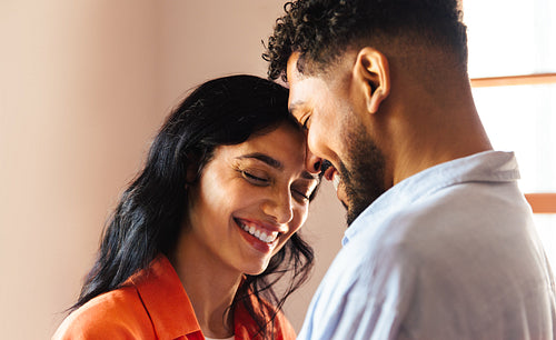 Loving Latino couple sharing a tender moment of joy and connection