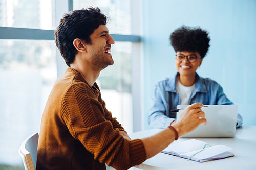Business people laughing during meeting