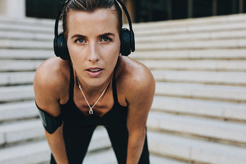 Close up of a woman athlete training wearing headphones