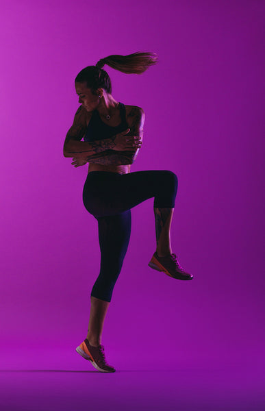 Athletic woman doing aerobic workout