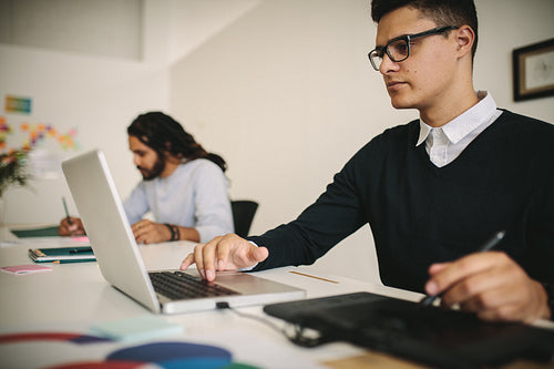 Business colleagues working in office