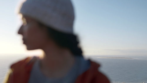 Girl looking away standing outdoors on winter day