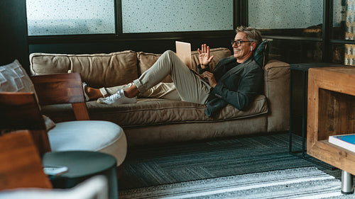 Businessman on video call with laptop computer