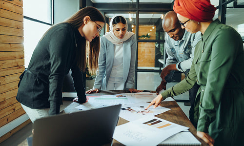 Diverse interior designers brainstorming in an office