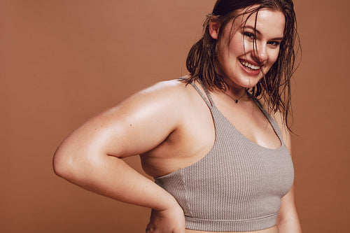 Plus size female model in sports bra