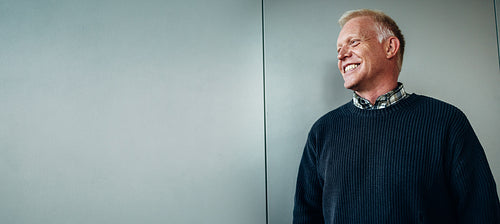 Senior businessman looking away and smiling