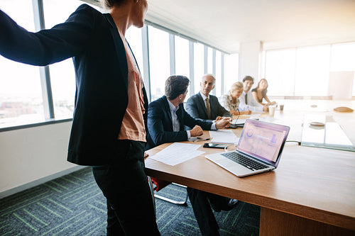 Corporate professionals have meeting in conference room