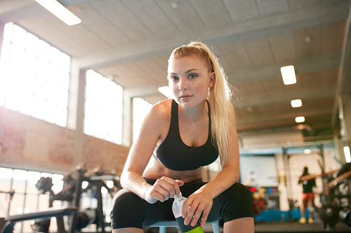 Beautiful woman during a break in the gym